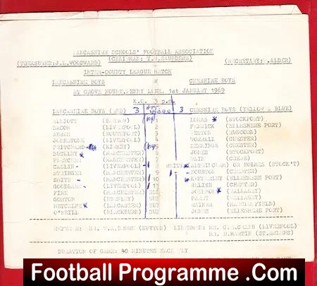 Photo of a vintage football programme page laid on a red surface, showing team lineups, score columns, and handwritten score tallies; a 'Football Programme .Com' watermark is visible at the bottom.