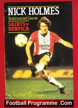Football programme cover: soccer player in red-and-white striped kit in action, with 'Nick Holmes' and 'Saints v Benfica' on the cover, bottom text 'Football Programme .Com'