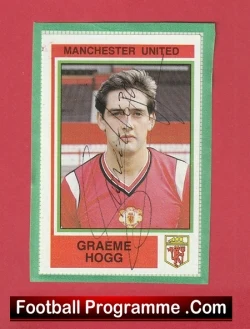Manchester United programme card with Graeme Hogg portrait in a red jersey, autograph across the photo on a pink background.