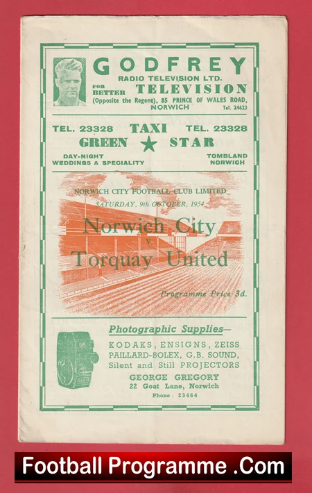 Front cover of a 1954 Norwich City vs Torquay United football programme with green ads and a stadium illustration.