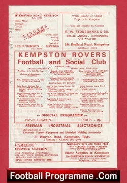 Front cover of Kempston Rovers Football Club programme, showing club name, match info, and sponsor ads on a red page.
