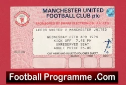 Vintage Manchester United football programme ticket on a red background, with 'Football Programme.Com' at the bottom edge.