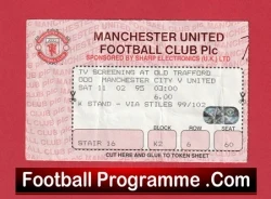 Ticket stub for a Manchester United match at Old Trafford, showing seat and match details, with a red bordered design and a black 'Football Programme.Com' banner.