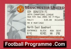 Manchester United football programme page with crest, Champions League badge, and a red FootballProgramme.com banner