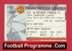 Ticket stub for Manchester United vs Olympiakos Piraeus FC with match details and the FootballProgramme.com banner