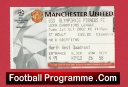 Football programme ticket for Manchester United’s Champions League match, with a red footer reading 'Football Programme.Com' at the bottom appetite.