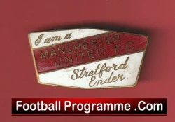 Vintage Manchester United supporter badge on a red background with a Football Programme.com banner at the bottom.