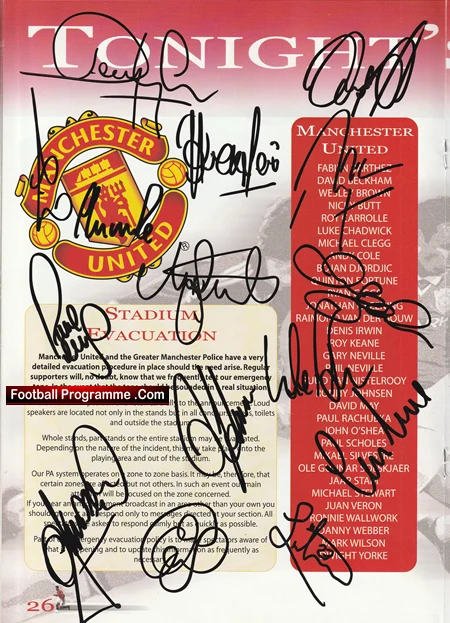 Manchester United football programme cover with club crest and multiple signatures across the page.