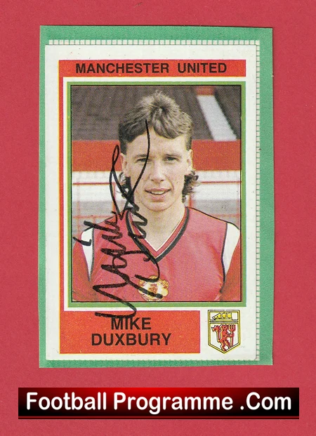 Autographed Manchester United trading card featuring Mike Duxbury in a red jersey with club crest visible at the bottom corner.