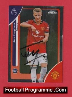 Autographed Manchester United trading card in red kit with blue border and 'Football Programme .Com' label on a red background.