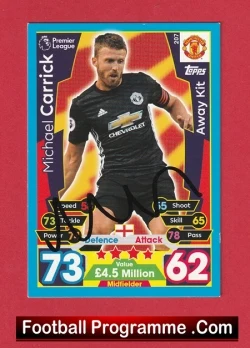 Michael Carrick trading card from a football programme, Manchester United away kit with a blue border and player stats.