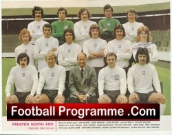 Group portrait of a football team in white kits on a stadium pitch, with a man in a suit seated center front; cover reads 'Football Programme .Com' at the bottom.