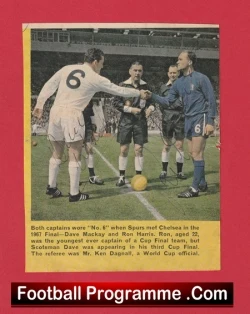 Cover of a vintage football programme showing captains in a pre-match coin toss/meeting on the pitch, with a caption about the 1967 match and 'Football Programme .Com' at the bottom.