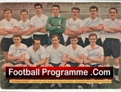 Vintage football team posing for a group photo, players in white shirts with a red 'Football Programme .Com' banner across the front.