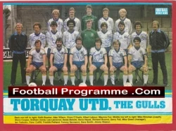 Torquay United football team photo on a program cover, players in white and blue kit with a banner reading 'Football Programme .Com Torquay Utd. The Gulls'