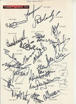 Page from a football programme filled with numerous player autographs and small printed names/positions around the signatures.