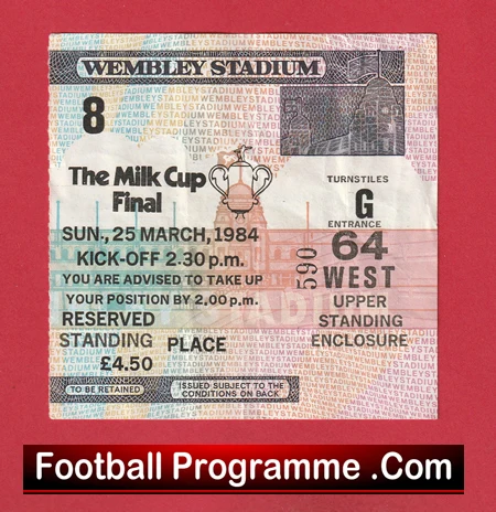 Ticket stub for the Milk Cup Final at Wembley Stadium, March 25, 1984, kickoff 2:30 pm, with seating/standing details and a small trophy graphic in the center. The image includes a red background and a 'Football Programme .Com' banner at the bottom.